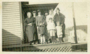 Galax - Harris Hotel
Granny Harris, Onnie Allred, Nettie [Allred] Marshall and Lee, Grace Harris, Mrs. Saunders Moore, E.M. Davis, John B and Jake
 
Also, written there is this note: "Harris Hotel, Galax Virginia--1917"
 
Also this note: "Building in background Luke Biships Livery Stable."
 
This should be Lute Bishop I believe.
 
The photo is not the best quality. Still, I thought it might be of interest to you. Nettie was the daughter of Thomas C. Allred and Julina Frost. Thomas was the son of Suttle, also written Settle, Allred whose wife was Eliza Belton. Suttle was the son of Jesse Allred of Randolph County, NC whose wife was Alcey York.
 
Julina Frost was the daughter of Stephen F. Frost a Civil war veteran from Carroll. I have a short note about him below. Stephen descends from the Revolutionary War soldier John Frost who is buried in the Frost cemetery in Carroll. I have a photograph of Stephen F. Frost, but it needs to be restored.
 
Courtesy of  Mike Marshall Summerfield, NC [email]mmarshall13@triad.rr.com[/email]
 

