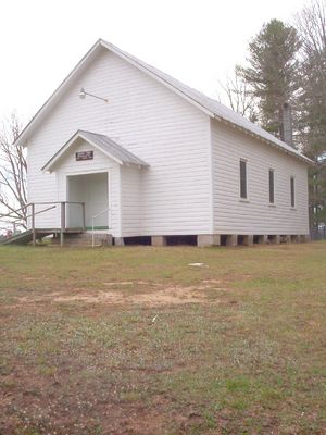 South Fork Regular Baptist Church, Piney Creek
This congregation was organized in 1840.  The church divided in the 1860s over the Civil War, with the other faction styling itself Primitive Baptist.  The Primitive Baptist faction had a meeting house on the Ashe County side of the South Fork.  This congregation closed about 1960, and that meeting house has gone to ruin.  This meeting house photo was taken April 16, 2006 by Jeff Weaver.
