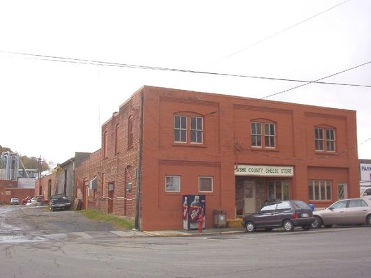 100_1787.jpg
This photo shows the offices and shop for Ashe County Cheese, North Carolina's only cheese factory.  It was established on Helton Creek about 1915, and then bought by Kraft Foods in 1929 and moved to West Jefferson.  When Kraft proposed to close it, the local employees bought it and continue to operate it.  Photo by Jeff Weaver, October 20, 2006.
