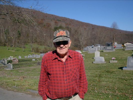 EarlBlevins.jpg
This very nice gentleman stopped what he was doing to show us where the Kell cemetery was.  Earl was blowing leaves off the parking lot of a community center across from the church. He (I think-I didn't write a thing down) is a descendant of Squire & Sarah Ann. He led us to the cemetery, went home & came back to make sure we got back down the hill alright. He gave me his phone # and called his cousin Daniel Smith Blevins in Marion about Rhoda. Anyway he was very helpful, friendly & nice. [email]Courtesy of Nanalee Wrenn[/email]

