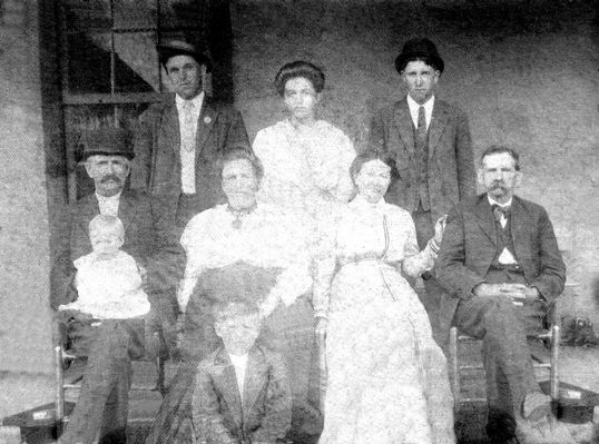 Perkins, Gordon Family
Here is, as written on the back of the picture, front row, Gordon Perkins, holding Foy? Perkins.
Standing-Clarence Perkins, "mama", Ed Perkins
Seated by Gordon and Foy are "grandma", "aunt Sally", Rudy and Mrs. Reedy.  The picture was badly damaged.  Gordon is a brother to Elvira Perkins Holdaway and son of Timothy and Elizabeth Sturgill Perkins.  Share with others.  Courtesy of Cathy Bell [email]cjbell47@goldenwest.net[/email]

