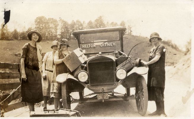 Helton Jitney
This one was in my aunt Lola Kilby Sewell's photo album. She moved to Harford County, MD, with her family (Roby and Eva Kilby family) in 1915 but returned to the mountains in the early 1920s to get her teaching degree from Boone. This photo caught my eye because this apparently was a mode of public transportation, presumably from Helton to Boone. I don't know that there was a "bus" from Harford County to Helton at that point. Later there was bus service from Bel Air to Sparta, I believe. She must have taken the train from Harford County to Boone. If you have any knowledge of this jitney, I'd like to know the facts. That's could be Aunt Lola on the left but I'm not positive.  Courtesy of Emily Kilby [email]erk44@verizon.net[/email]

