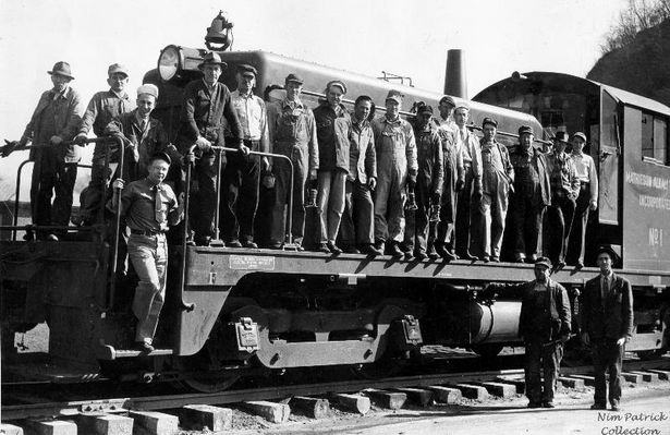 Saltville - Mathieson Alkali Works Train Crew 1947
TRAIN CREW  /   MATHIESON ALKALI WORKS  /  SALTVILLE OPERATIONS  /  SALTVILLE, VA.  /  SHOWING THE NEW DIESEL LOCOMOTIVE  /  1947
 
 FROM LEFT - BILL  DAVIDSON,  WALTER  SWORD,  UNKNOWN - A GENERAL MOTORS FACTORY REP,  JOHN  LITTLE,  CHARLIE  CALL,  JOHN  LOUTHIAN, ESSIE  GREER,  GEORGE "PENNY" HAYNES,  ANDREW  FRYE,  JOHN  BORDERS,  LEO  FIELDS,  UNKNOWN - A GENERAL MOTORS FACTORY REP,  JOHN HENRY SHORTT,  EUGENE  CASSIDY,  RALPH  COMER,  ED  PATRICK, STANDING ON STEPS AT FRONT OF ENGINE - AUDREY  BILLINGS; STANDING ON GROUND - FROM  LEFT - ROME  NIPPER  AND  JOE  DAVIDSON
 
PHOTO  COURTESY  EDDIE  "NIM"  PATRICK.  Courtesy of Don Smith [email]dsmith1043@comcast.net[/email]


 
Keywords: Smyth County, Va, Train, Saltville, Mathieson Akali, Diesel, Locomotive