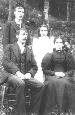 SheetsFamily.jpg
Seated: Ellis Sheets and Millie Perry Sheets (born ca 1871).  Back: Ellis' brother and Ettie Sheets (Millie's daughter) Millie was a daughter of Solomon and Tobitha Ham Perry.  Courtesy of Mary Ann Talbott [email]matalbott@seidata.com[/email]
