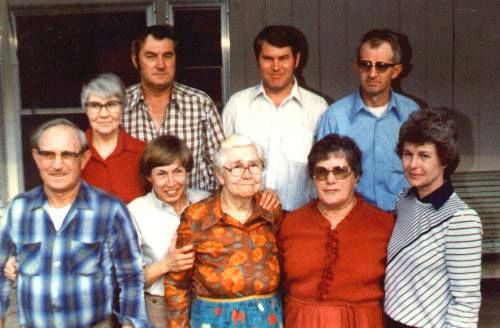 afw2.jpg
Front row, left to right, Arthur Jackson Weaver, Hazel Weaver Poole, Fannie Blevins Weaver, Mary Weaver Blevins, Maxine Weaver Blevins; back row, left to right, Mattie Weaver Waddell, J. Clayborn Weaver, George Weaver, Dillard Weaver.  Photo taken March 13, 1982 at Grassy Creek, NC by Jeff Weaver, on the occasion of the funeral of Clarence Edward Weaver.
