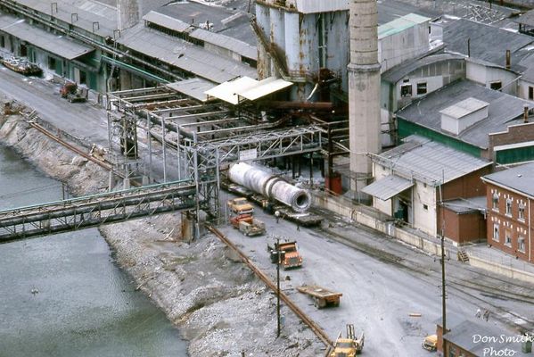 Saltville - Decommisining of Olin May 1972
THESE ROTARY DRIERS ROTATED AND DRYED THE SODA ASH AND MOST OF THE TIME THERE WAS A SNOWSTORM OF ASH COMING FROM AROUND IT FILLING THE FLOOR UNDERNEATH. THE ASH THAT LEAKED OUT WOULD BE SHOVELED UP AND ROLLED BY WHEELBARROW TO THE DIRTY ASH POT, COOKED AND SENT TO THE CAUSTIC SHED. 
 
THERE WAS NOTHING QUITE LIKE THE DRY SIDE OF OLIN'S AMMONIA SODA DEPARTMENT.  Courtesy of Don Smith [email]dsmith1043@comcast.net[/email]

 
