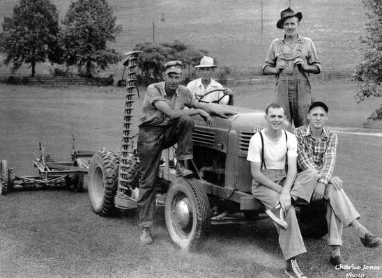 Saltville - Golf Course Maintenance
THE SALTVILLE GOLF COURSE WORK CREW  /  SALTVILLE, VIRGINIA  /  AUGUST 1949
 
DRIVING THE TRACTOR - HOWARD WOODWARD  /  LEFT - ED SMITH  /  STANDING - CAL SMITH  /  ON BUMPER - LEFT - BOBBY  (HOECAKE)  JOHNSON  AND  BILL  AUSTIN
 
THE  TRACTOR  WAS  A  WORTHINGTON  CHIEF  GOLF  COURSE  TRACTOR,  ORANGE  IN  COLOR,  MANUFACTURED  IN  STROUDSBURG,  PA.
 
CHARLIE JONES  /  PHOTOGRAPHER.  Courtesy of Don Smith [email]dsmith1043@comcast.net[/email]
