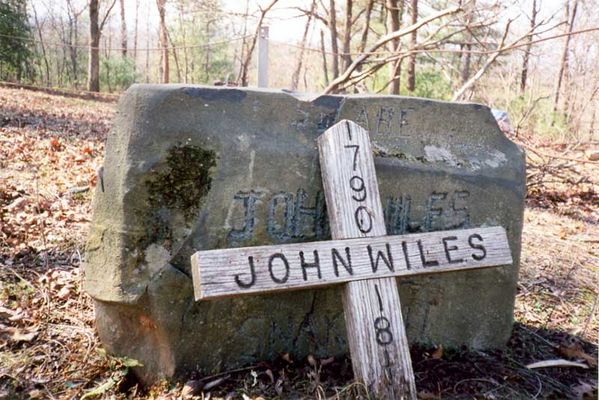 "Snakebite" John Wiles
Headstone of "Snakebite" John Wiles (1790-1815).  He was buried in the Holloway Cemetery, located deep in the woods on Wiles Ridge, near Traphill.  Picture taken in 2000.  Courtesy of Jason Duncan [email]jmduncan@statesville.net[/email]

