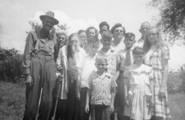 Kelly, John M. 
John Morgan Kelly, son of Peter Kelly and Margery Hash Kelly of Ashe County, NC is shown here late in life in Raleigh County, WV with his family.  Courtesy of Lee Hash [email]leehash@aol.com[/email]
