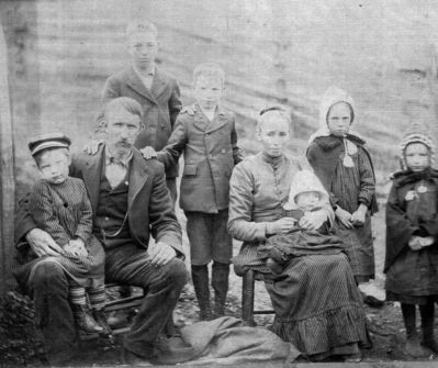 Phipps, Emory Family
Phipps Family
 
This is a picture of the Emory Phipps family.  Based on information I've researched, I believe the following to be true:  Emory Phipps is seated with Thomas Phipps on his lap, his wife Ida Perry Phipps is holding Delmar Emory Phipps on her lap with daughters Elva Phipps Sage and Ora Phipps Hamby.  One of the two standing boys is Roscoe Phipps and the other is unknown - not sure which is which.  I believe this picture was taken in 1912 because Ida died in May 1912.  Any information about the individuals in the picture would be greatly appreciated.  Picture submitted by great granddaughter Lynn Sexton Gallegos  Arbadella64@yahoo.com

