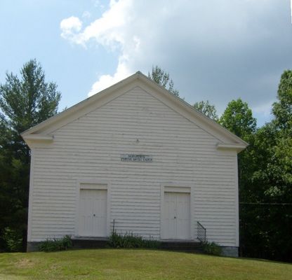 Saddle Creek - Saddle Creek Primitive Baptist Church
Established in1842, Saddle Creek Primitive Baptist Meeting-house is one of the most recognizable landmarks west of Independence, as it is located on the southside of U.S.58 the main east-west thoroughfare through Grayson County.  This style of meeting house with the dual front doors was popular in the late 19th century.  Men would enter on one side and women on the other.  Photo June 8, 2007 by Jeff Weaver
