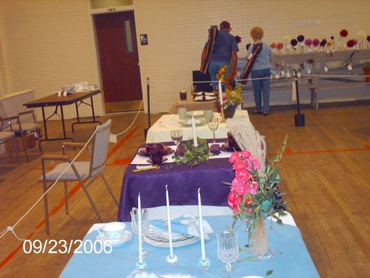 pics 117.jpg
This shot shows some of the judged table arrangements.  The table with the purple cloth won first place, entered by Katherine Beattie.  Photo September 23, 2006 by Jeff Weaver.
