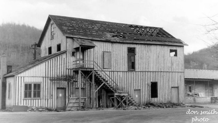 salthouse1.jpg
A CLOSER LOOK AT THE OLD SALT HOUSE BUILDING.

OLD SALT HOUSE BUILT ON THE SITE OF THE GEORGIA SALT FURNACE.  THE SALT HOUSE WAS USED FOR STORING SACKS AND BARRELS.  AFTER IT WAS NO LONGER USED FOR THAT THE TOP FLOOR BECAME THE MEETING PLACE FOR WILLIAM KING MASONIC LODGE NO. 227 OF SALTVILLE FROM 1901 UNTIL A NEW MEETING HALL WAS BUILT IN DOWNTOWN IN 1949.
 
THE BOTTOM FLOOR WAS USED BY MATHIESON CHEMICALS.
 
IN MARCH OF 1965...SHORTLY AFTER THIS PICTURE WAS MADE, THE OLD SALT HOUSE WAS TORN DOWN.  IT WAS LOCATED ON WEST MAIN STREET IN SALTVILLE, VIRGINIA.  Courtesy of Don Smith [email]dsmith1043@comcast.net[/email]
