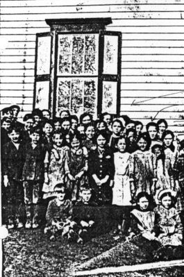 schkidsgrassycrk.jpg
My grandmother Rosa May Reeves is in this picture. She was born in 1900, so I figure this picture to be taken around 1908. This school is in Grassy Creek.  Courtesy of Bill Payne.
