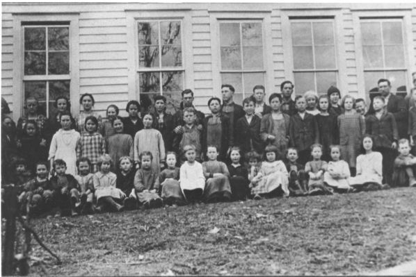 wolfknobschool20a.jpg
This is a school photograph made at the Wolf Knob School in the early 1920s.  Wolf Knob School, Rugby, Grayson County, Virginia, ca. 1920

Left to right, 1st row: Boy behind tree unknown, Raymond Owen, Monty Greer, Severt Spencer, May Perry, Clyde Kilby, Mary Edith Farmer, Jincy Duvall, Grace Kilby, Blanche Owen, Gaither Testerman, Mazie Farmer, Wave Farmer, Vincy Spencer, Woodrow Kilby.
2nd Row: Blair Kilby, Guida Sturgill, Vilena Weaver, Gay Reedy, Mamie Greer, Cora Greer, Ralph Spencer, Walter Perry, Chester Testerman, Gaither Farmer, Cora Sturgill, Maggie Owen, Cleve Farmer, Charlie Duvall, Dean Kilby, Mae Sebastian (Teacher), Ruth Kilby, Charity Kilby, Maryann Spencer, Sybil Owen, Fanny Kilby, Cody Owen, Ora Kilby, Garman Spencer, Arthur Farmer, Otis Kilby, Nancy Jane Farmer, Ersadell Sturgill, Gaither Kilby (Teacher), Guy Kilby.


