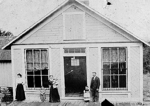 wt_store.jpg
William T. Porter b abt 1863 d 13 Apr 1940 and his 1st wife Etta Jane Mallory b 06 Dec 1866 d 12 Nov 1905. This is his store that was located near Fries VA. Children in photo are Verna, Vestal, and Clarence. I don't know who the dark haired woman is.
Courtesy of Terry Porter.

