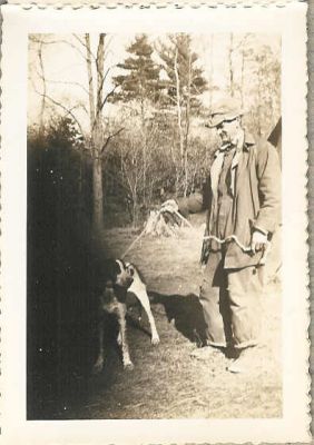 This is Steve Russell of Flat Ridge with his dog, Queen. Taken about 1945.
